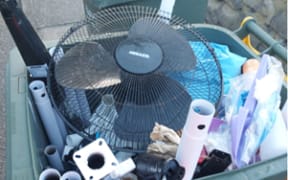 A yellow-top recycling bin filled with items that are not accepted at the Tauranga Material Recovery Facility where the bins’ contents are taken. Photos supplied