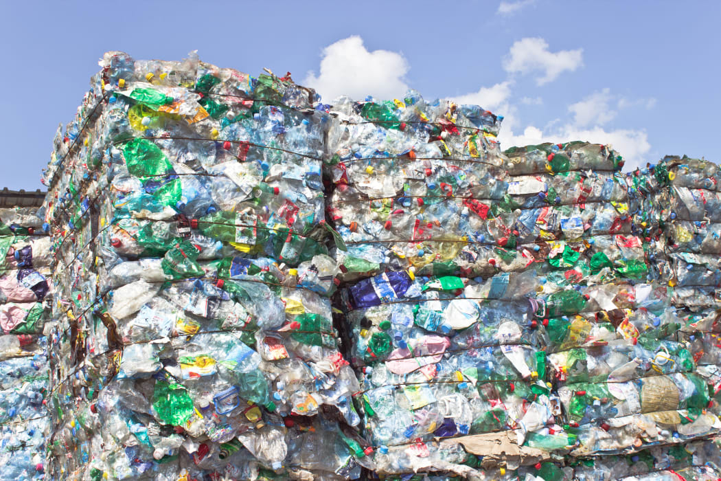 Stack of plastic bottles for recycling.