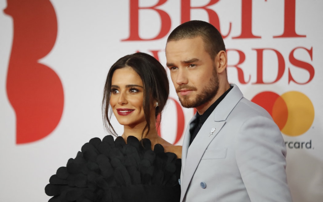 British singer-songwriter Liam Payne (R) and partner Cheryl pose on the red carpet on arrival for the BRIT Awards 2018 in London on February 21, 2018. (Photo by Tolga AKMEN / AFP) / RESTRICTED TO EDITORIAL USE – NO POSTERS – NO MERCHANDISE– NO USE IN PUBLICATIONS DEVOTED TO ARTISTS - RESTRICTED TO EDITORIAL USE – NO POSTERS – NO MERCHANDISE– NO USE IN PUBLICATIONS DEVOTED TO ARTISTS