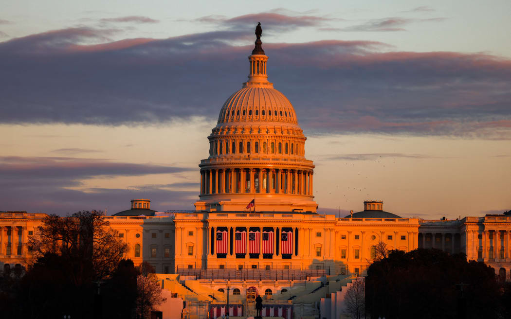 The US Capitol is seen in Washington, DC, on 18 January 2025 as the US capital prepares for the inauguration of US President-elect Donald Trump. Donald Trump confirmed that his inauguration as US president on January 20 will move indoors due to expected freezing weather, undercutting the Republican's hopes for a grandiose spectacle to kick off his second term. (Photo by CHARLY TRIBALLEAU / AFP)
