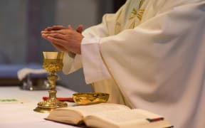 Priest during a wedding ceremony/nuptial mass