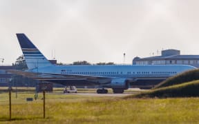 WILTSHIRE, UK - JUNE 14: A Spanish-registered "Privilege Style" civilian aircraft Boeing 767 is seen parked up at the British MoD Boscombe Down, which is the home of a military aircraft testing site, on the southeastern outskirts of the town of Amesbury, Wiltshire, England on Tuesday, June 14, 2022. The aircraft stands ready on a Ministry of Defence runway to take the first migrants to the east African country tonight. Vudi Xhymshiti / Anadolu Agency (Photo by Vudi Xhymshiti / ANADOLU AGENCY / Anadolu Agency via AFP)