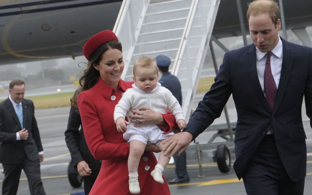 The Duke and Duchess with Prince George at Wellington Airport after being welcomed by Prime Minister John Key (far left).