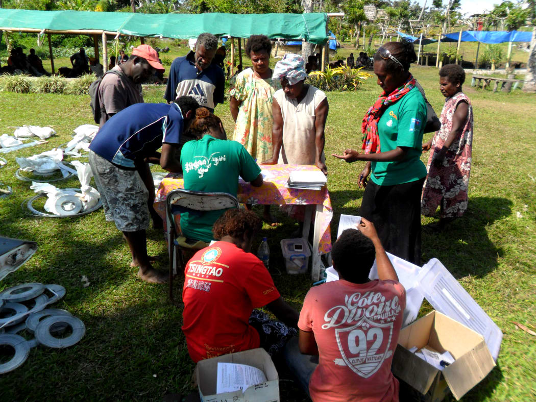 Rebuild kits being distributed on Tanna in Vanuatu by Care International.