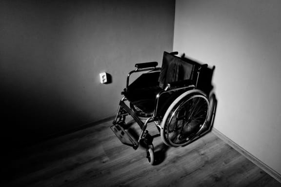 Wheelchair in a dark room