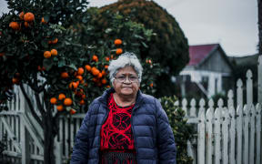 Liliani Waigth outside her garden, named Kolokakala.