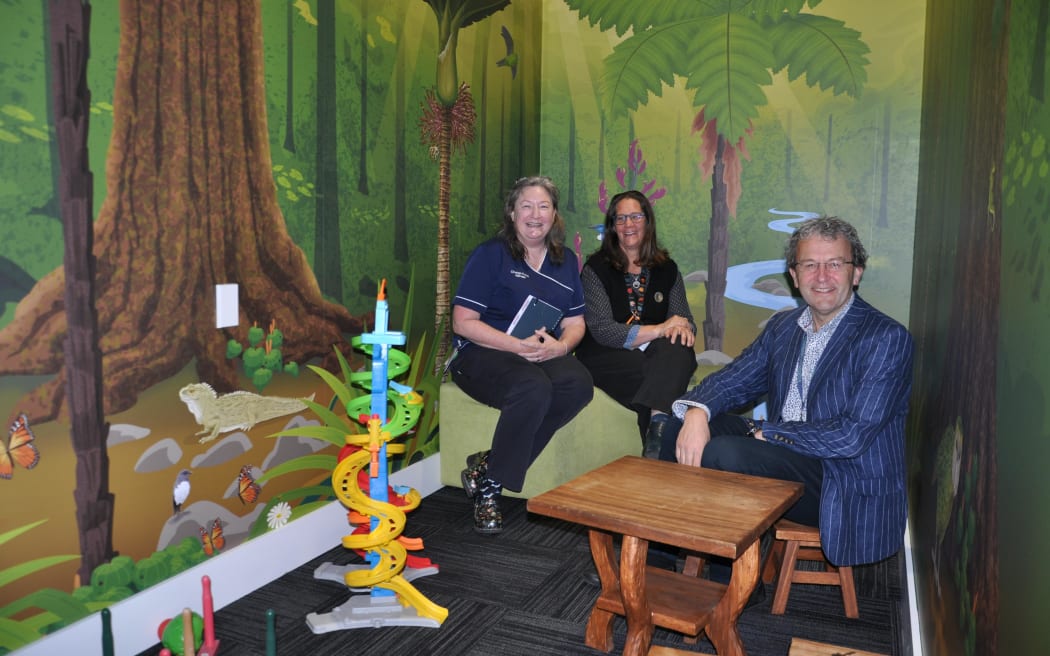 Te Whatu Ora Nelson Marlborough clinical nurse manager Rebecca McKegg with paediatricians Dr Helke Florkowski and Dr Garth Smith in the children's play area. RNZ/Samantha Gee.