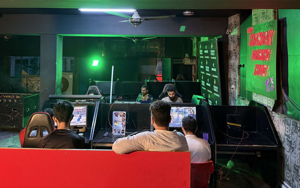 Gamers practice at the Maniax arcade.