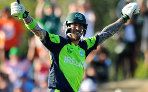 Ireland player John Mooney celebrates hitting the winning runs.