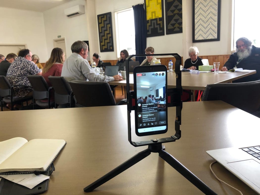 Wairarapa's district councils are using digital tools in different ways for meetings. Here, a Carterton District Council meeting is captured by smart phone.