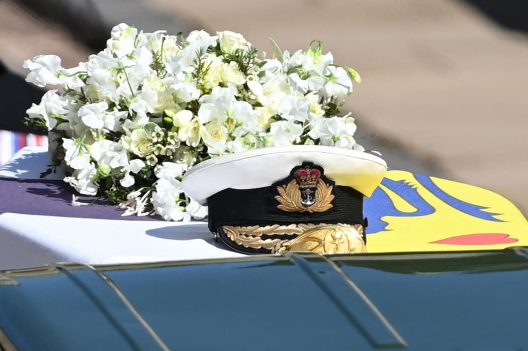 A wreath of flowers lies on the coffin during the ceremonial funeral procession of Britain's Prince Philip, Duke of Edinburgh to St George's Chapel in Windsor Castle in Windsor, west of London, on April 17, 2021.