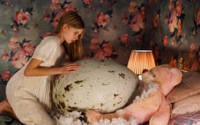 A still from the 2022 Finnish horror film Hatching