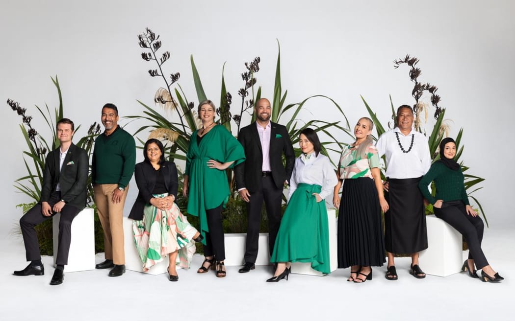 Group of people posing in variety of uniforms