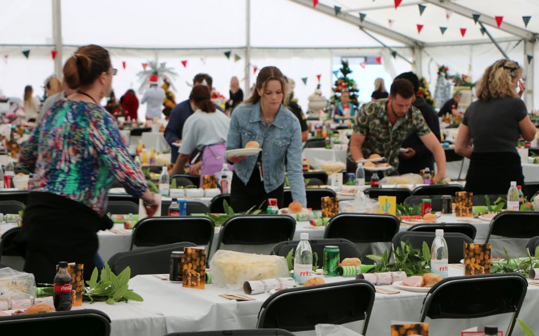 Volunteer Paige Vallance helps serve up food at the Christchurch City Mission lunch