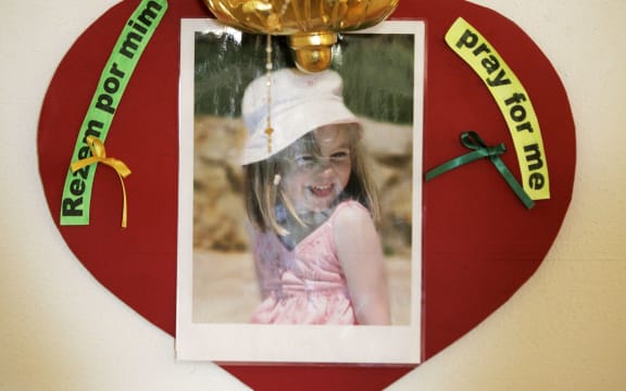 A photo of Madeleine McCann surrounded by messages saying 'pray for me'.