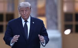 US President Donald Trump gestures as he arrives at Chateau de Versailles ahead of a dinner to celebrate the 250th anniversary of the independence of the United States, in Versailles southwest of Paris on June 17, 2026. (Photo by Guillaume BAPTISTE / AFP)