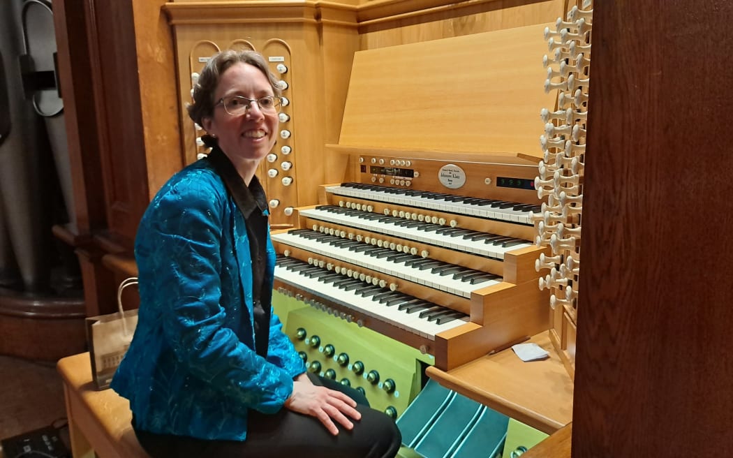 Isabelle Demers sitting at the console of the Auckland Town Hall Organ