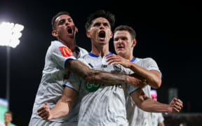 Logan Rogerson celebrates the equalising goal for Auckland FC against Adelaide United.