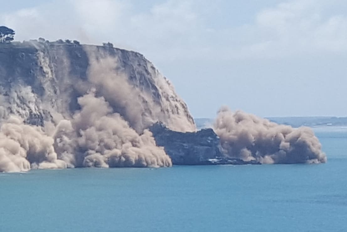 The view from Godley Head Track of a cliff collapsing near Sumner.