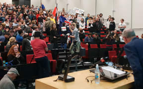 Protesters at the Auckland University debate.