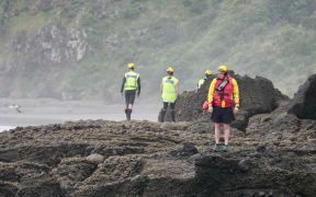 Searches are being carried out for a fisherman missing at O'Neill's Bay, near Bethell's Beach on Auckland's west coast.