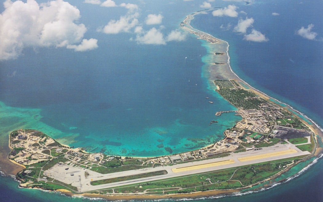 An aerial view of the southern portion of Kwajalein Atoll, with the US Army base island at Kwajalein visible in the foreground with runway, and Ebeye, home of the two missing fishermen, the third island on the right side along the eastern reef of the atoll.