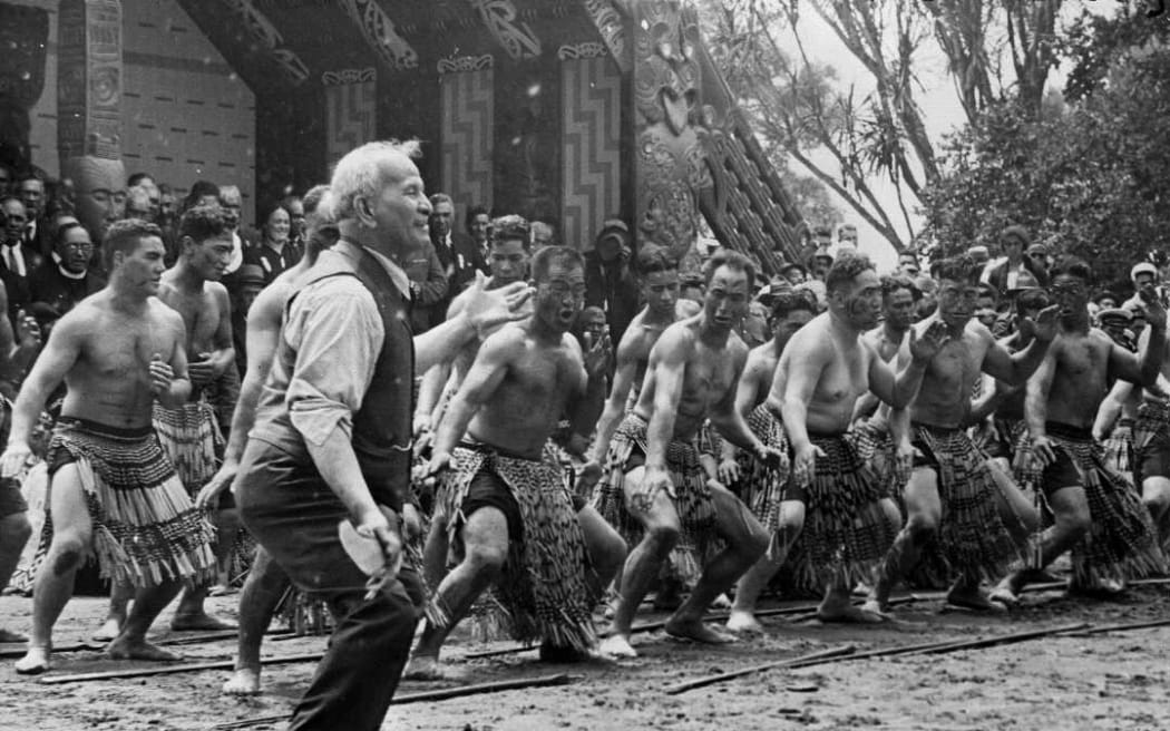 Apirana Ngata taking the lead in a haka on Waitangi Day at the centennial celebrations at Waitangi, 1940