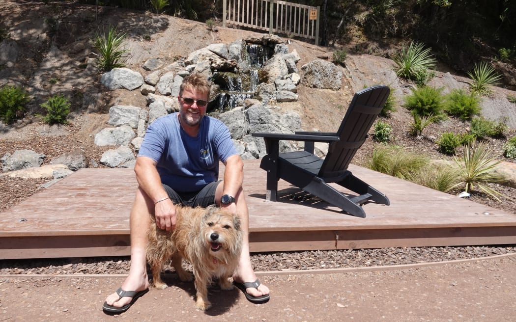 Project driver Grant Harnish and Rosie, a “Northland special”, at the new park’s waterfall.