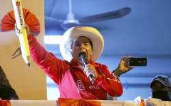 Peruvian leftist presidential candidate for Peru Libre party Pedro Castillo delivers a speech to supporters from a balcony at his campaign headquarters during his closing rally in Lima.