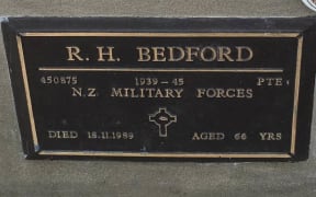 The bronze plaque on the grave of WWII veteran Raymond Bedford, which was stolen on Sunday - just two days before Anzac Day.