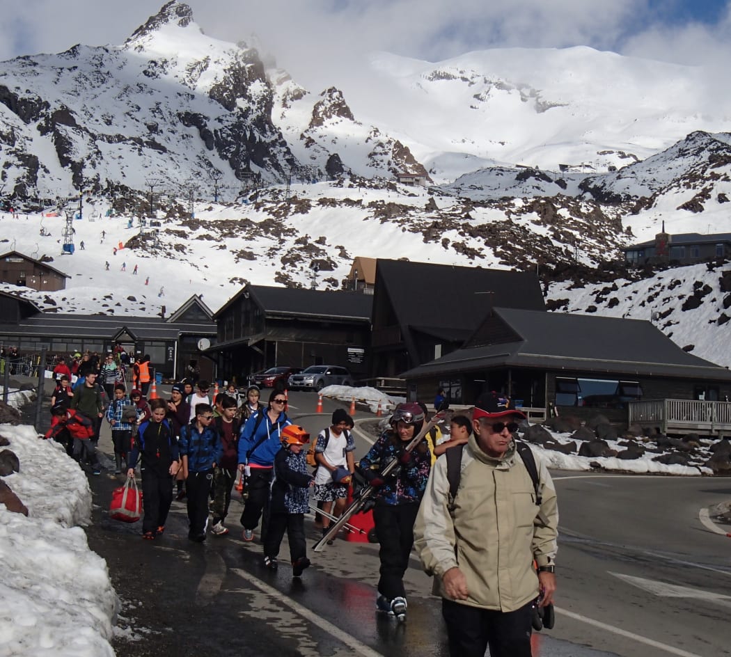 On a busy day, the Whakapapa ski area on Mount Ruapehu hosts thousands of visitors, seen here leaving the field at the end of a fine day.