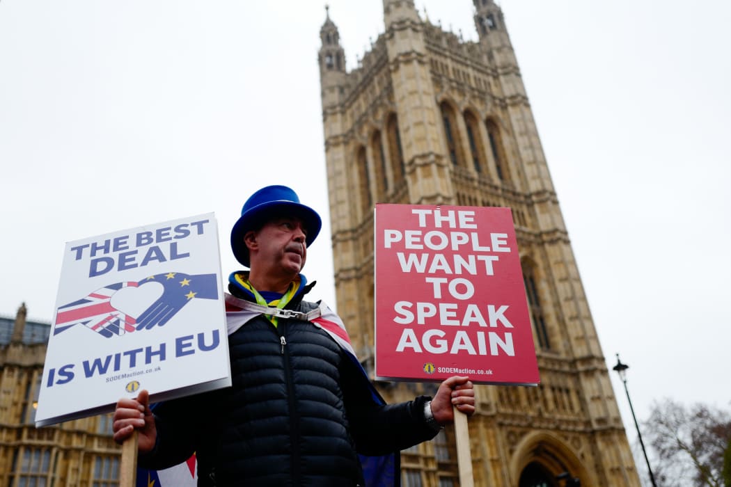 Anti-Brexit activist Steve Bray stands holding placards outside the Houses of Parliament in central London on January 16, 2019.