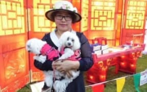 Elizabeth Zhong, pictured with her dogs in 2014.