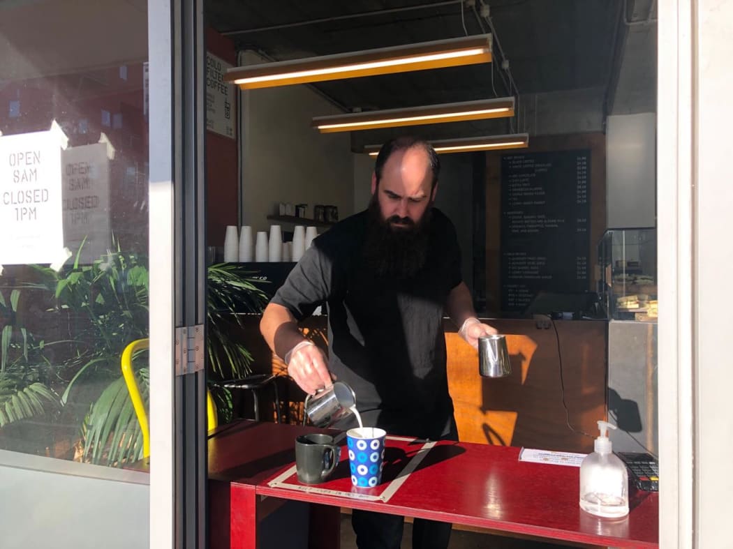 Morgan West owner of Wellington cafe Milk Crate takes on the 'contactless pour'.