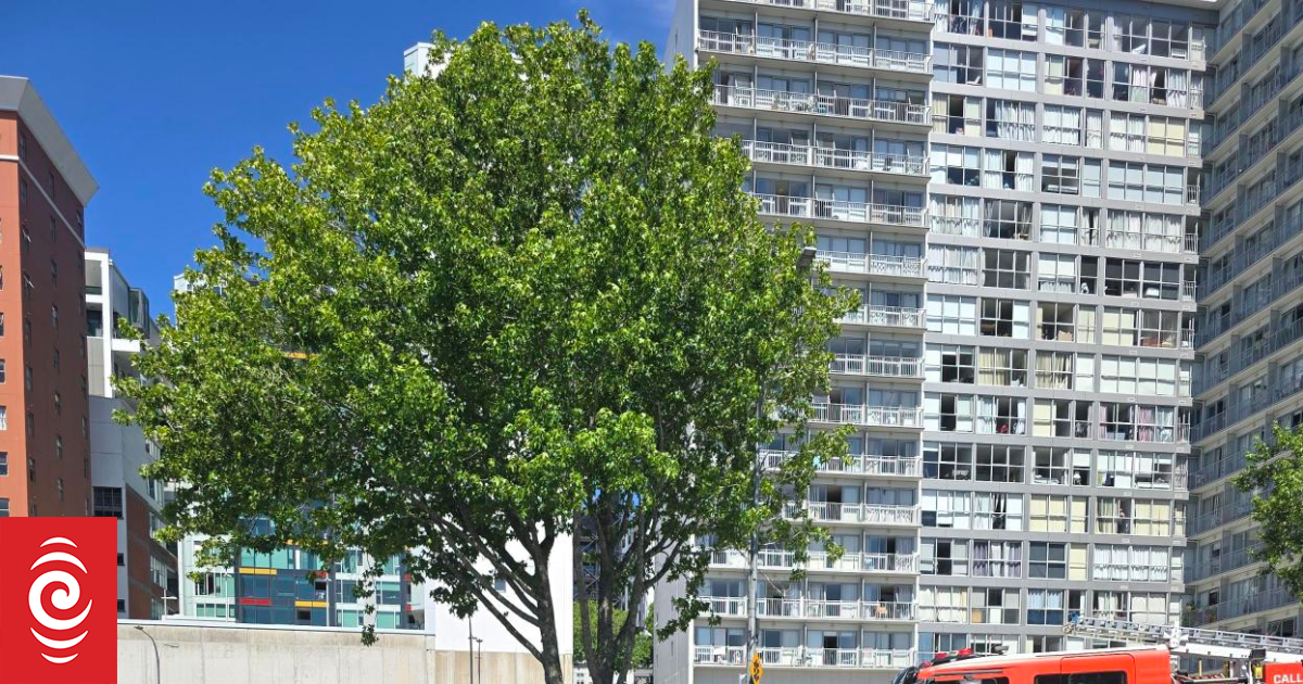Car tips onto side after crash on Nelson Street in central Auckland
