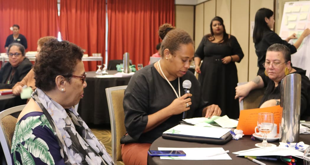 Amelia Nairoba addresses the meeting.