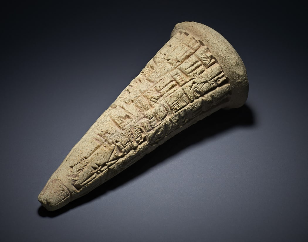 A Sumerian clay cone, dating to around 2200BC, bearing a cuneiform inscription.