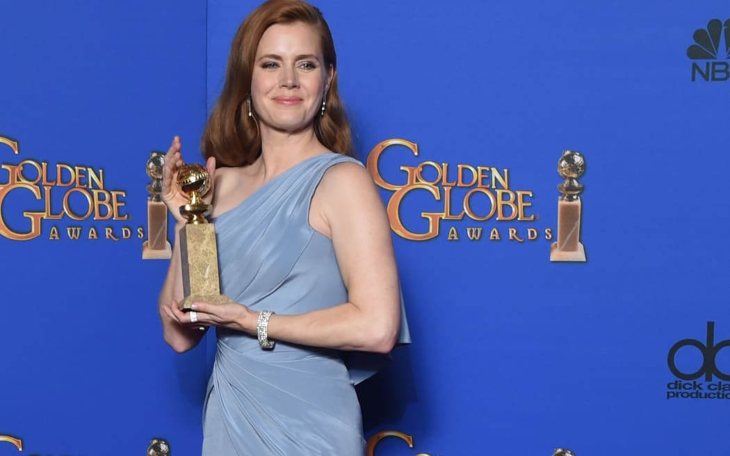Actress Amy Adams holds the award for Best Actress, Motion Picture, Comedy or Musical for her role in "Big Eyes", in the press room at the 72nd annual Golden Globe Awards, January 11, 2015 at the Beverly Hilton Hotel in Beverly Hills, California.