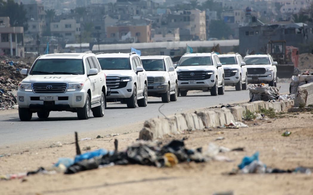 A convoy carrying senior UN Coordinator for Humanitarian Action and Reconstruction in Gaza Sigrid Kaag drives on a road in Khan Yunis in the southern Gaza Strip on October 15, 2024, amid the ongoing war between Israel and the Palestinian militant group Hamas in the besieged Palestinian territory. - Israel has been intensifying its offensive in the besieged Gaza Strip, which the United Nations warned on October 15 is suffering under its worst aid restrictions since the war there began over a year ago. (Photo by Bashar TALEB / AFP)