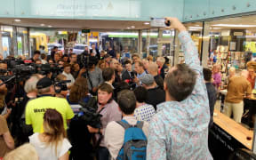Nicky Hager and Jon Stephenson in a media scrum at the launch of 'Hit and Run.'