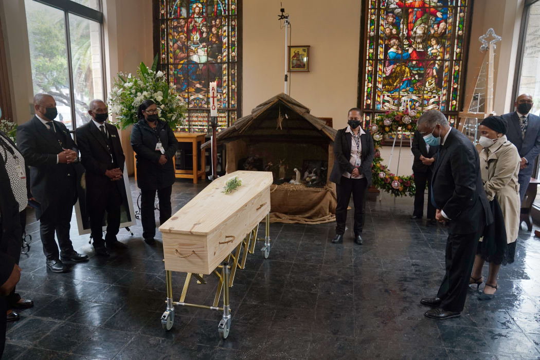 Former South African President Thabo Mbeki (2nd R) and his wife Zanele Mebki (R) pay their respects to the late Archbishop Desmond Tutu as he lies in state at St. George's Cathedral in Cape Town.