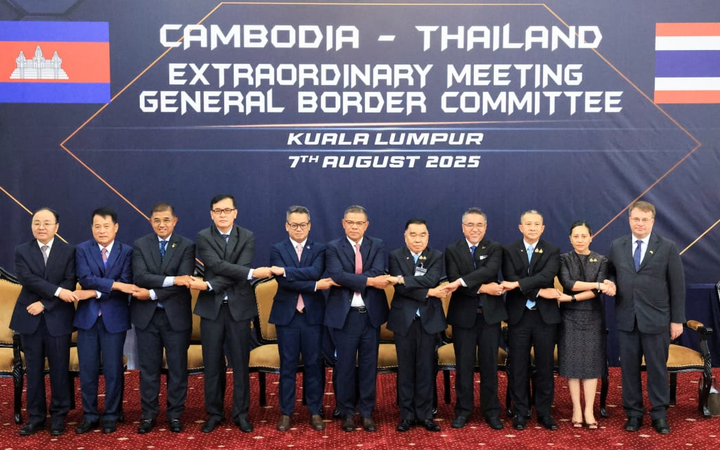 Thai delegates led by Deputy Defence Minister Natthaphon Narkphanit (5th-R), Malaysian Home Minister Saifuddin Nasution Ismail (C) and Cambodian delegates led by Defence Minister General Tea Seiha (5th-L), pose for a group photo ahead of the Extraordinary General Border Committee (GBC) to discuss their border dispute between Thailand and Cambodia, in Kuala Lumpur.
