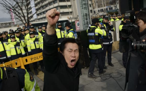 A man takes part in a protest in Seoul against the North Korean regime on Sunday.