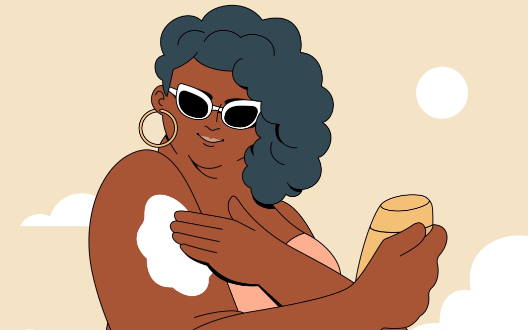 Woman applying sunscreen.