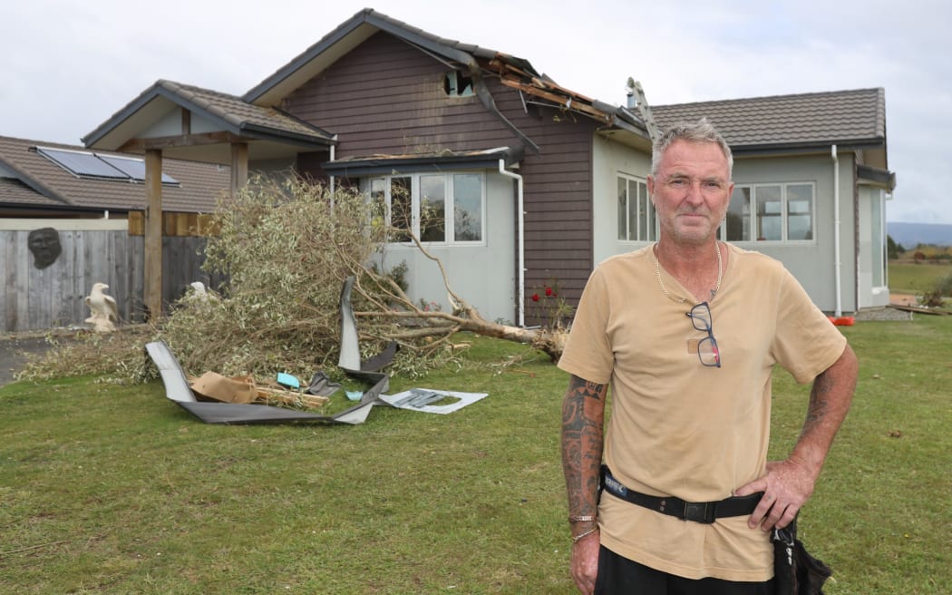 Kenny Cripps' house was hammered by the tornado, with a tree going through the roof and tarseal smashing the windows.