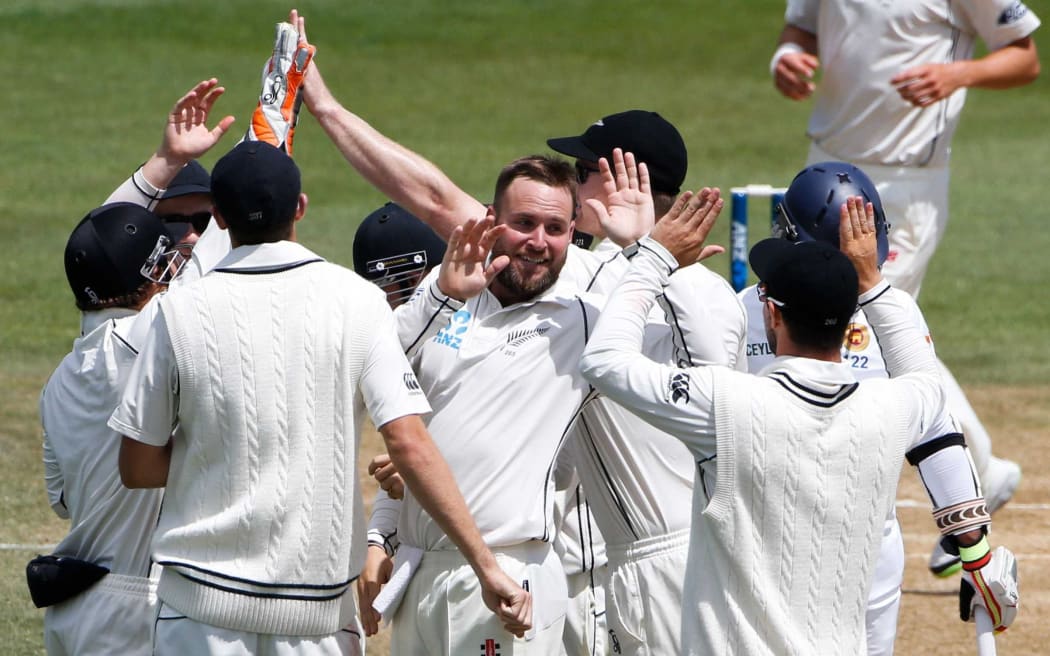 Mark Craig and the team celebrate the wicket of Rangana Herath.