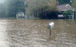 Baton Rouge: Two people have died and one remains missing as torrential rains continue to inundate both Louisiana and southern Mississippi, flooding homes and forcing evacuations and water rescues on August 13, 2016.