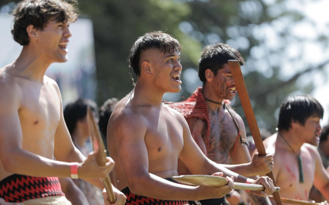 Many of the crowd joined in the challenge to coalition government members as the haka pōwhiri roars and conches blare.