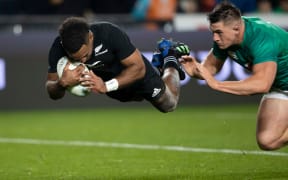 All Blacks winger Sevu Reece scores a try against Ireland.