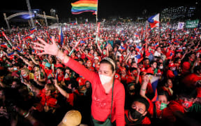 Supporters of Philippine presidential candidate Ferdinand Marcos Jr cheering during the last campaign rally ahead of the today's election.